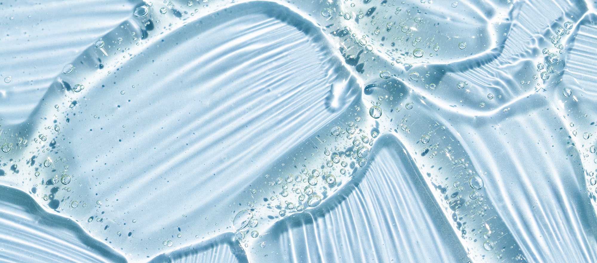 Close up of clear gel on blue background